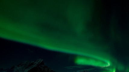 Northern lights over the vilage of Reine, Lofoten, Norway