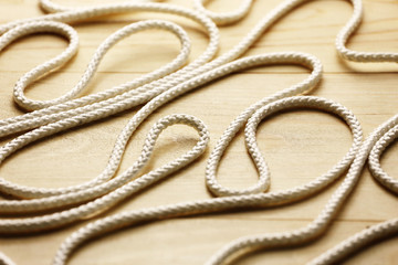White rope close up on a wood background