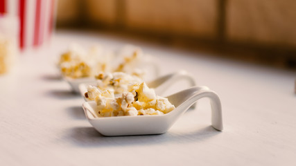 Samples of popcorn on white background.