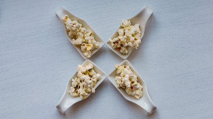 Samples of popcorn on white background.