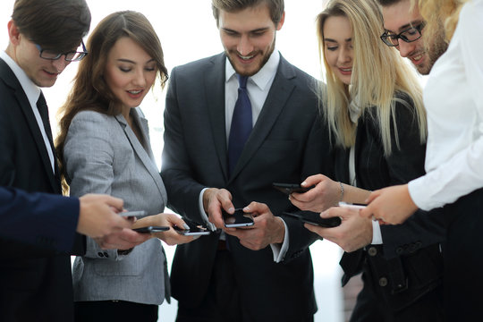 Close up businessman and woman using smart phone