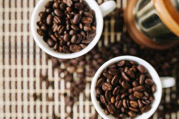 two cups of coffee on a wooden table