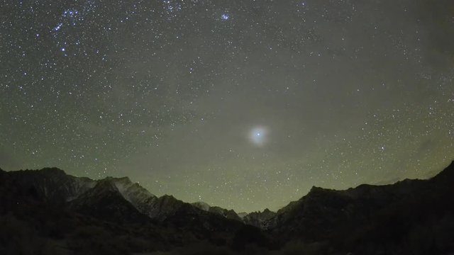 Moonrise and star time lapse above Mount Whitney in the Sierra Nevada Mountains near Lone Pine, California.