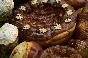 Traditional Russian Easter baked goods, kulichi, patties with cottage cheese, karavai and loaf cake...