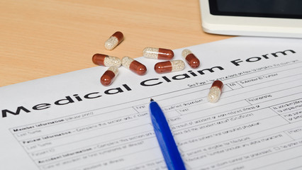 medical claim form on a wooden surface