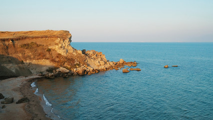 Fototapeta na wymiar sea coast of Crimea with rocky shores and rocks in the Black Sea with beautiful turquoise water
