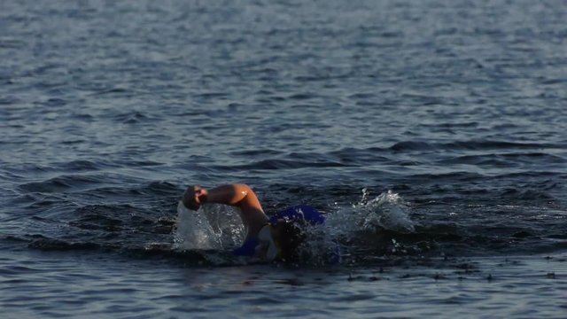 young boy swims to dock tower 4k