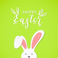 Green background with text Happy Easter and rabbit ears