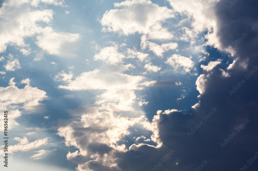 Wall mural white curly clouds in a blue sky. sky background