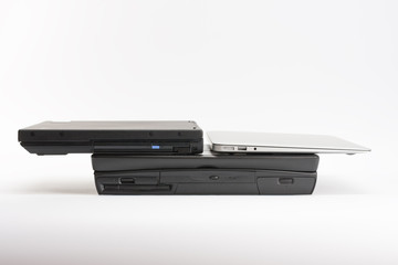 Comparing of laptops, new modern and old laptops, present and past