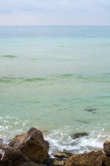 Green water rocks and seafoam