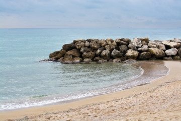 Water and rocks winter beach
