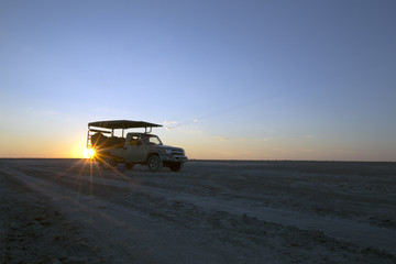 Fototapeta na wymiar Vehicle at sunset