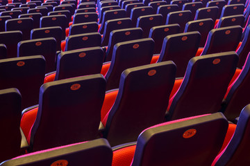 Rows of bright red seats in the cinema