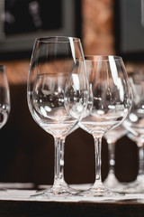 empty glasses of different shapes served for a wine tasting