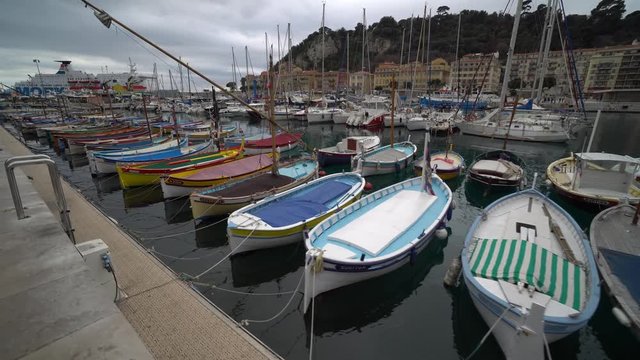 Many different of small fishing boats at port of Nice, France
