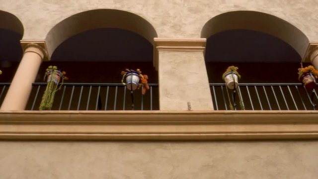 Looking up and moving along the colonnade at the Visitor&rsquo;s Center in Balboa Park, San Diego.