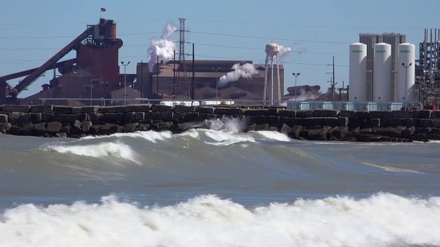 Waves roll in near a highly polluted industrial area on Lake Michigan near Gary, Indiana.