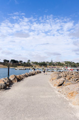 Walkers on seawall vert