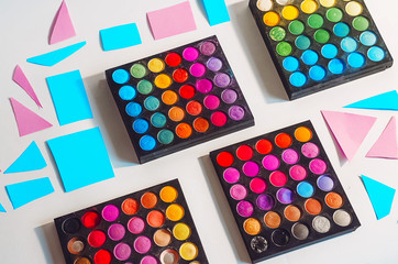 different colors of shadows. make-up artist and stylist. bright colors. minimalism. view from above