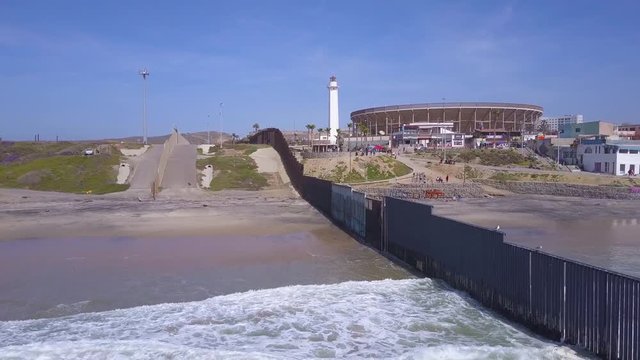 Good aerial of the U.S. Mexico border fence in the Pacific Ocean between San Diego and Tijuana.