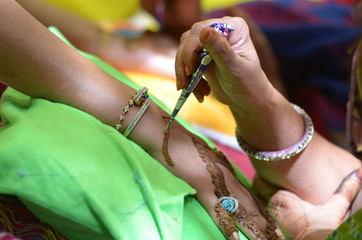 applying henna on hand, Hindu wedding ,Rajasthan, India