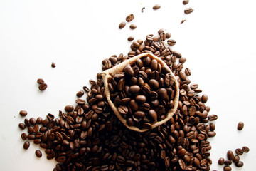 coffee beans in white background / A coffee bean is a seed of the coffee plant and the source for coffee.