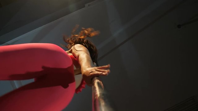 Sexy blackhair girl pole dance in pink	