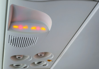 No smoking and fasten seat belt sign inside an airplane, aircraft