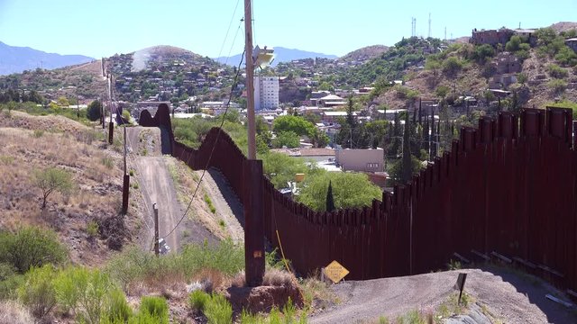 A view along the US Mexico border wall at Nogales, Arizona.