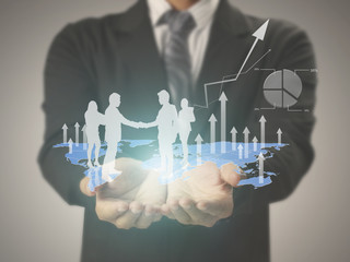 financial symbols coming from hand