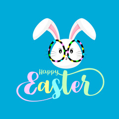Fototapeta premium Happy Easter Hand lettering and typography with cute bunny. Illustration for your designs: t-shirts, bags, posters, invitations, cards, etc. Isolated on blue background.