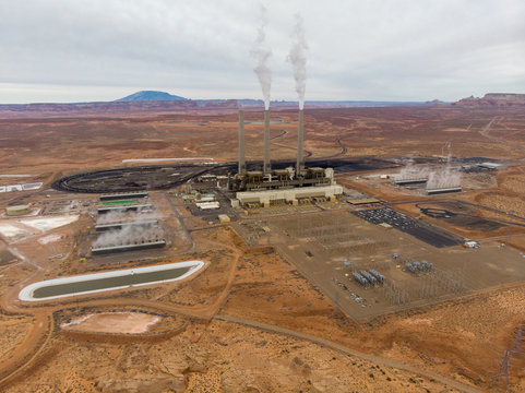 Energy Power Plant In The Desert With Smoking Tubes