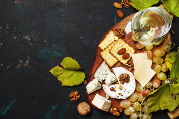 White Dry Wine, Cheese With Mold, Nuts, Grape And Cracker, Dark Background, Top View