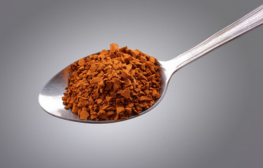 coffee in spoon isolated white background
