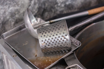 scoop and dipper for make noodle on the stove in resturant in Thailand, metal cooking tool 