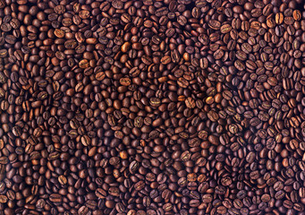 Background of grains of roasted coffee close-up
