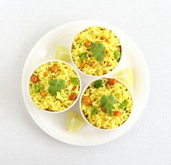 Lemon rice, a south Indian traditional, popular, delicious and vegetarian rice dish, in three bowls.