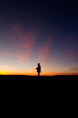 Sunset silhouette of girl
