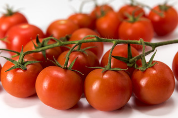 cherry tomatoes, placed on a white background, macro