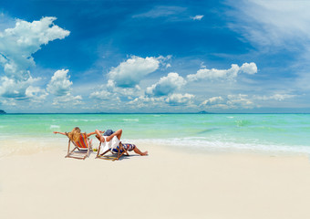 Couple on the beach at tropical resort iin Thailand