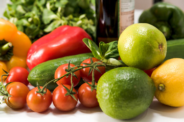 fresh raw vegetables, salad preparation, pepper, tomatoes, cucumber, fresh salad, lime, lemon, cheese