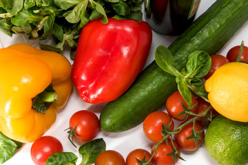 fresh raw vegetables, salad preparation, pepper, tomatoes, cucumber, fresh salad, lime, lemon, cheese