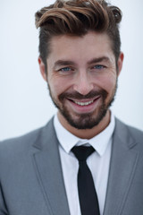 Serious businessman wearing suit and tie. blue background
