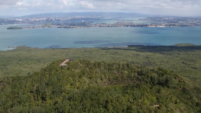 Drone shot of Rongitoto Summit viewpoint with Auckland city in the distance.