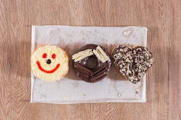 Donuts on wooden background