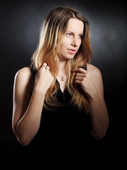 woman in studio on black background