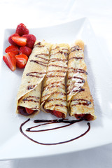 Sweet strawberry pancakes with chocolate