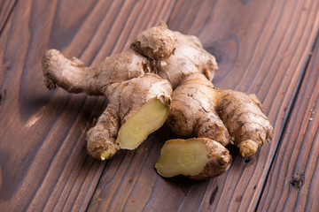 Ginger root on rustic brown wooden background