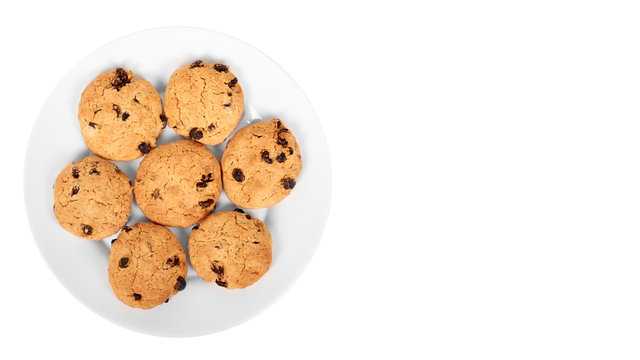 Pile of chocolate chip cookies on a dish isolated on white background. copy space, template